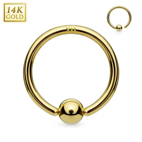 Piercing anneau boule fixée en or jaune 14 carats