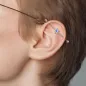 Piercing industriel oreille fleur opaline bleue