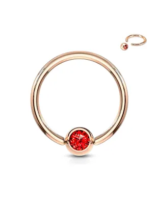 Piercing anneau captif or rosé cristal rouge