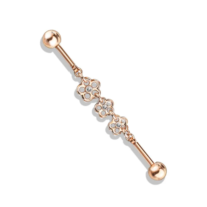 Piercing industriel oreille or rosé chaine triple fleur